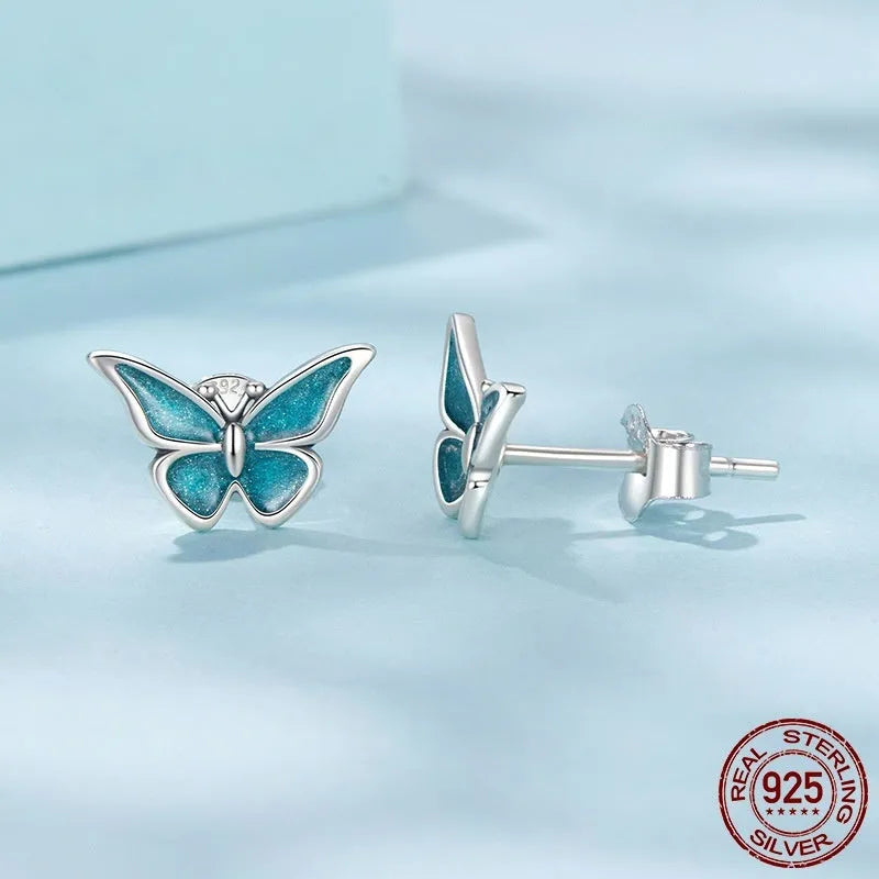 925 sterling silver blue butterfly small ear studs for women with dripping oil colour finish on white background