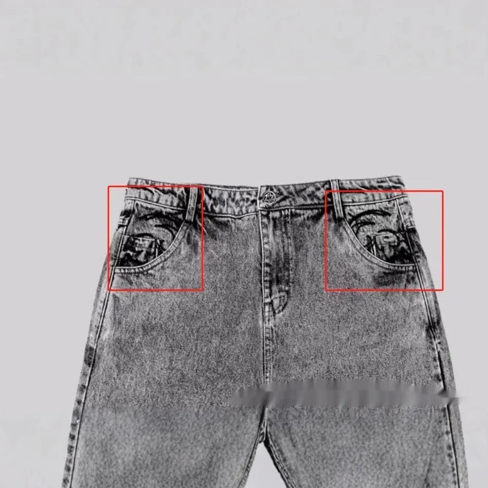 Grey loose-fit straight-leg cotton denim trousers on a hanger.