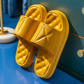 A pair of soft EVA bathroom slippers with a thick non-slip sole, shown in available colours.