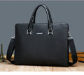 One-shoulder cross-slung male business briefcase in PU leather, horizontal square shape, black colour, zipper closure, stitched detailing
