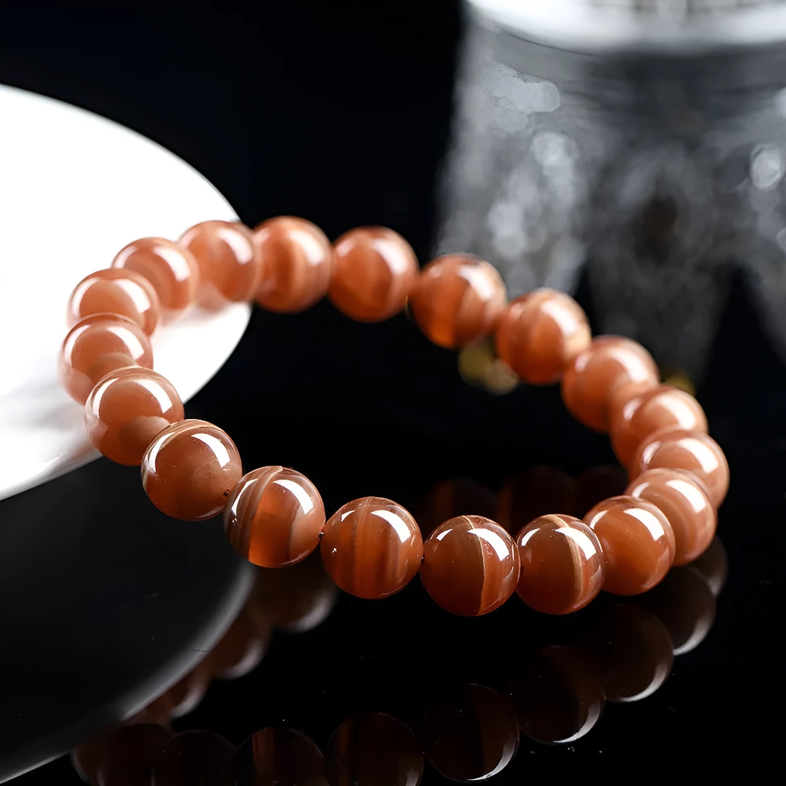 Natural old mine rhodochrosite round bead bracelet with geometric design and Ruyi elements.