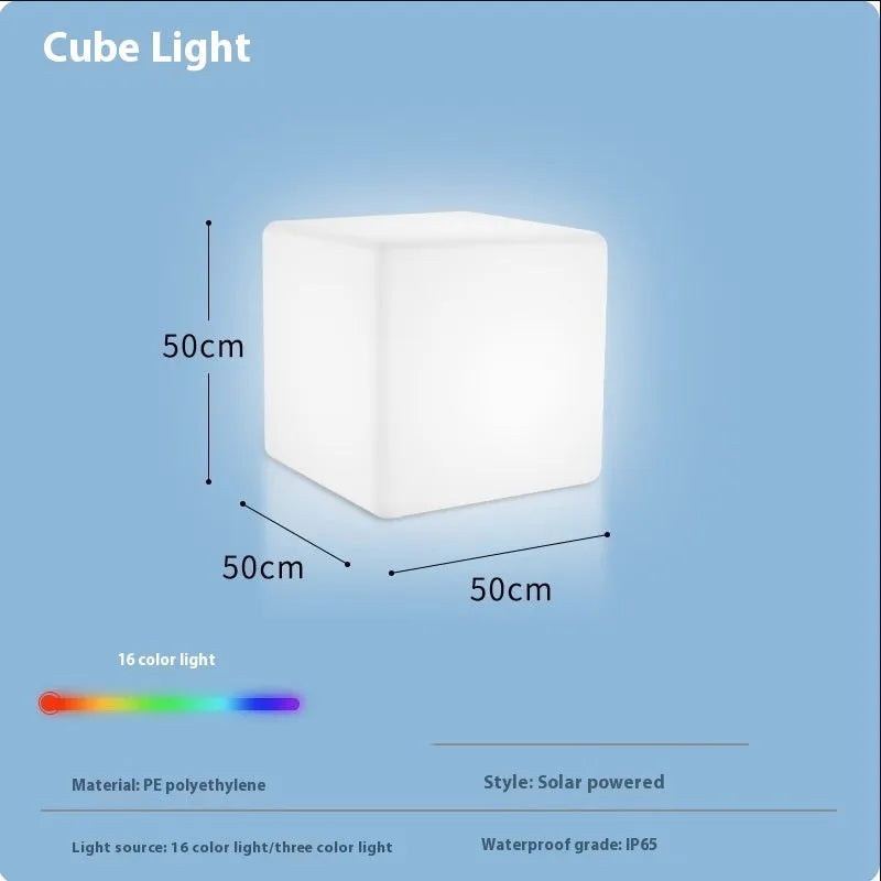 Modern white LED cube stool light outdoors, showing flat top and clean design.