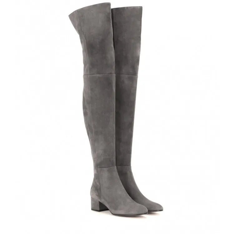 Grey suede women's over the knee flat boots with a pointed toe and thick low heel.