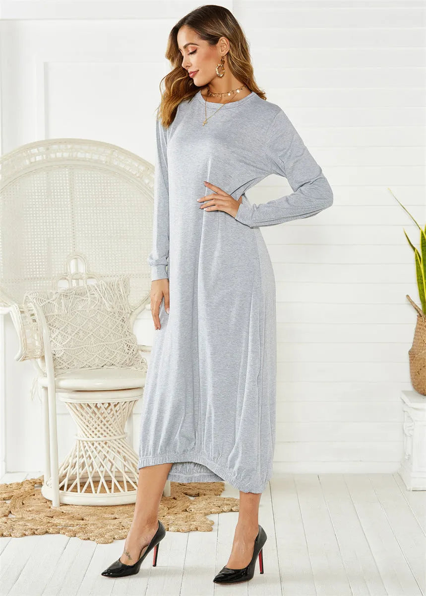 Black knitted lantern dress with loose fit sleeves and lace-up front detail on a mannequin.
