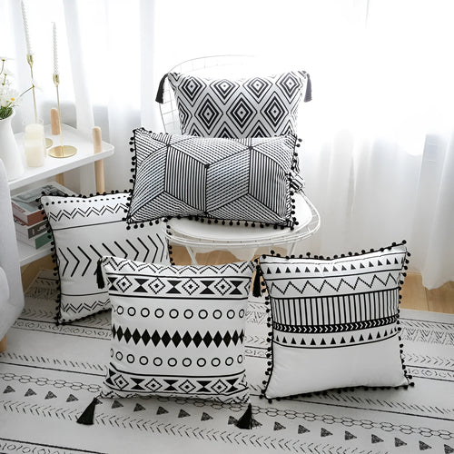 Bohemian style throw pillow on a sofa, available in light grey, black, or white, shown in 45x45cm size.