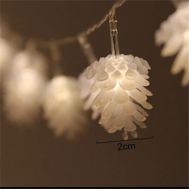 LED pine cone light string with plastic shell housing in warm white colour