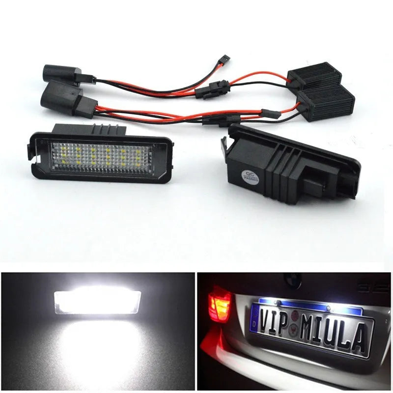 Pair of white LED license plate light bulbs for Volkswagen cars with Canbus resistors.