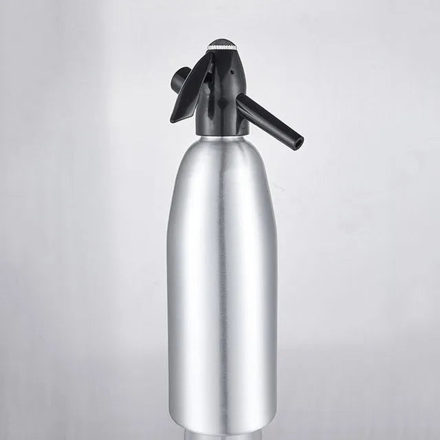 Silver portable 1L aluminium soda maker with pressure regulator and safe cover on table