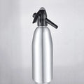 Silver portable 1L aluminium soda maker with pressure regulator and safe cover on table