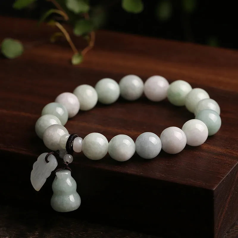 Natural jade Buddhist hanging bracelet showing geometric shape and symbolic charms