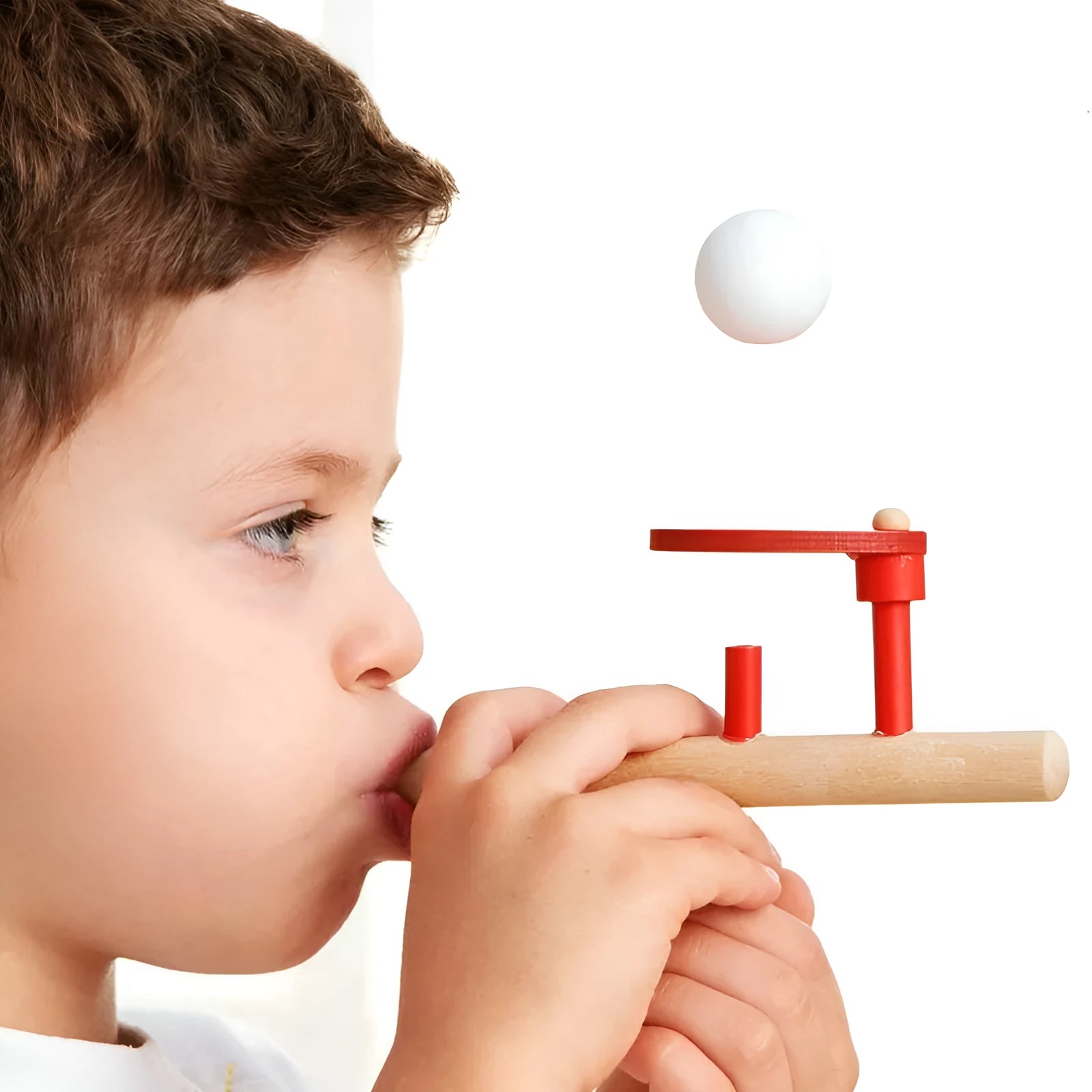 Wooden blowing balls magic suspension toy in red colour, 14 x 6 cm, on a white background