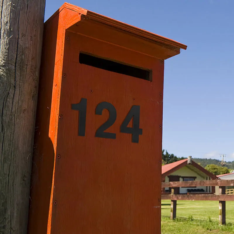 Black stainless steel sticky house number 7.5cm tall with self-adhesive backing.