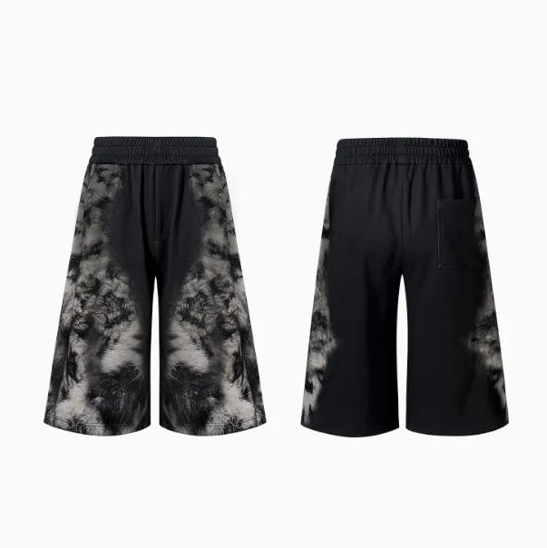 Loose fit streetwear co-ord set showing shorts, trousers, and hoodie with collage stitching detail