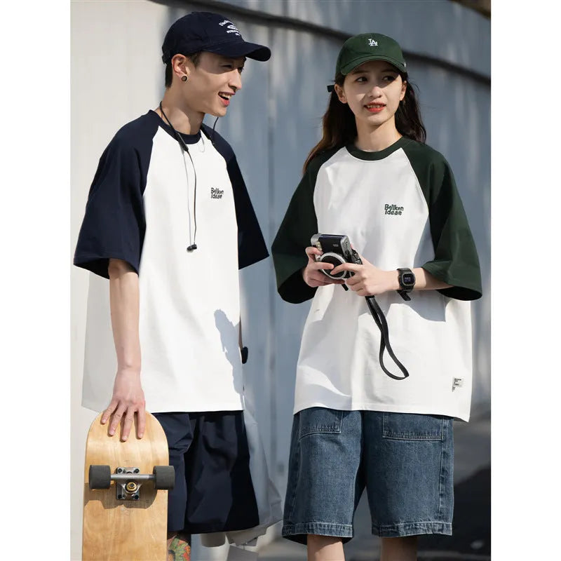 Man wearing a loose blue raglan sleeve casual t-shirt, Japanese style, thin polyester blend.