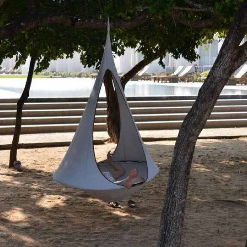 Lightweight portable flying saucer hammock in green oxford cloth with metal frame for camping and outdoor leisure