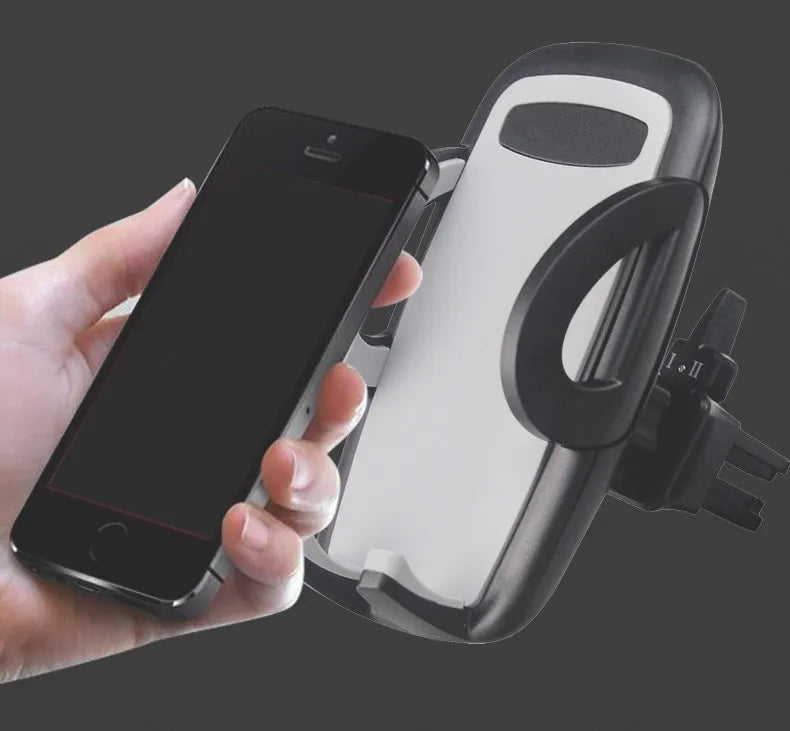 Black universal car air vent mobile phone holder mounted on a car vent, holding a smartphone.