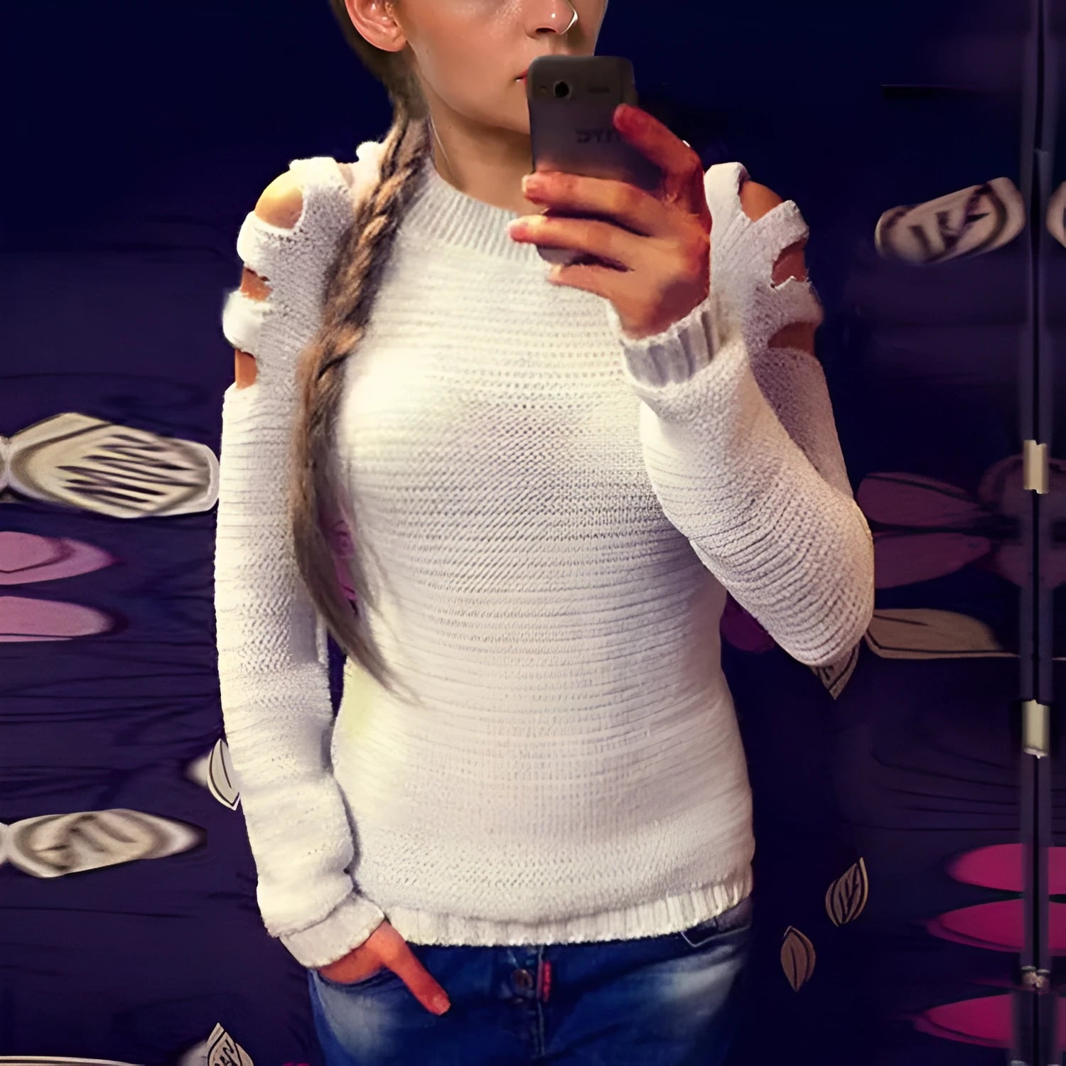 Women's grey knitted pullover shirt with crocheted hollow-out patterns on the sleeves and body.