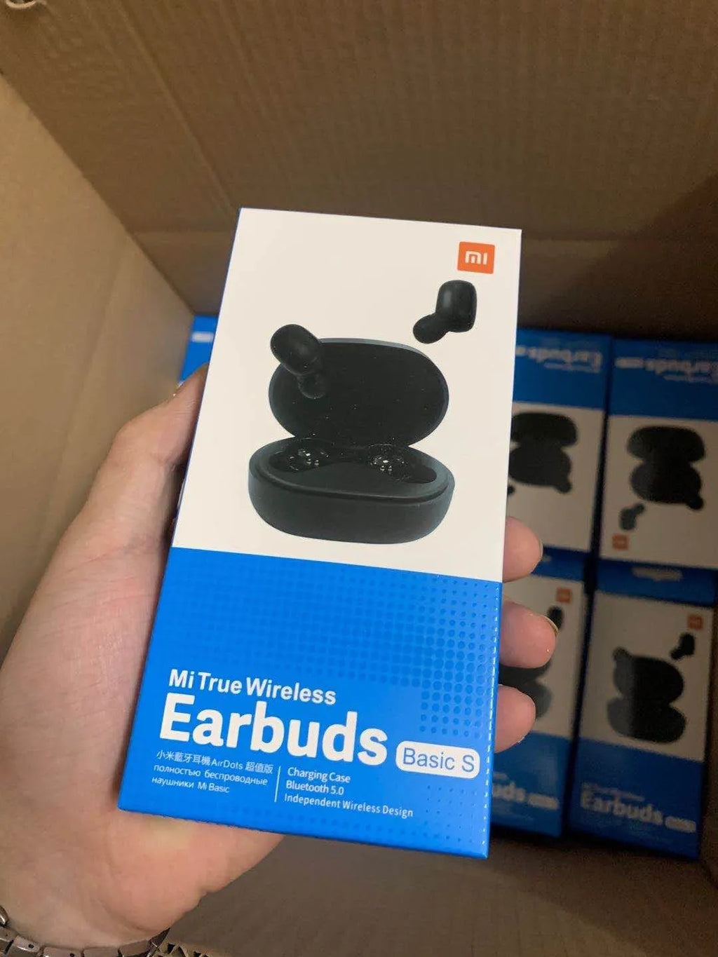 Redmi AirDots Black true wireless earbuds and charging case on a white background.