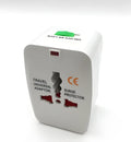Universal travel plug adapter for multiple countries measuring 73x50x39mm
