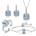 925 sterling silver jewellery set with sky blue topaz stones, including necklace, bracelet and earrings