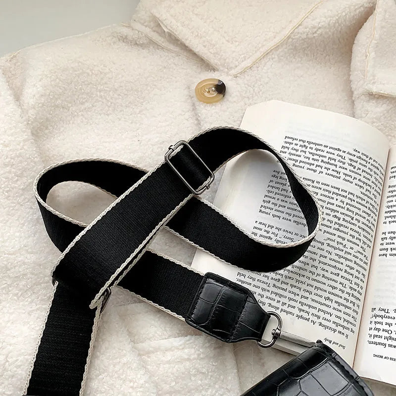 Vintage-style black PU leather crossbody bag with adjustable strap