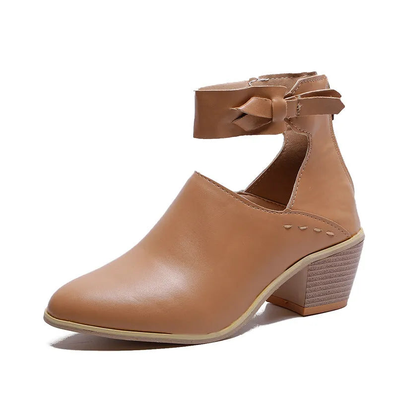 Vintage high heels woman ankle boots with round toe and middle heel in black artificial PU