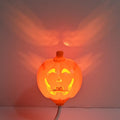 Plastic pumpkin-shaped USB lamp emitting yellow or purple light, 8.3cm wide by 22cm tall