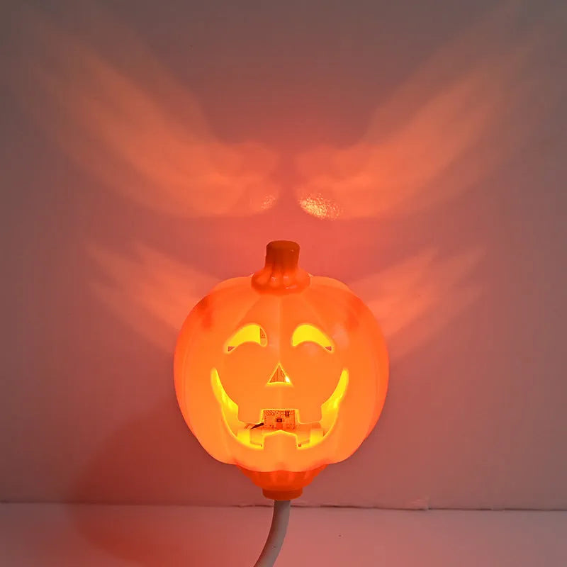 Plastic pumpkin-shaped USB lamp emitting yellow or purple light, 8.3cm wide by 22cm tall