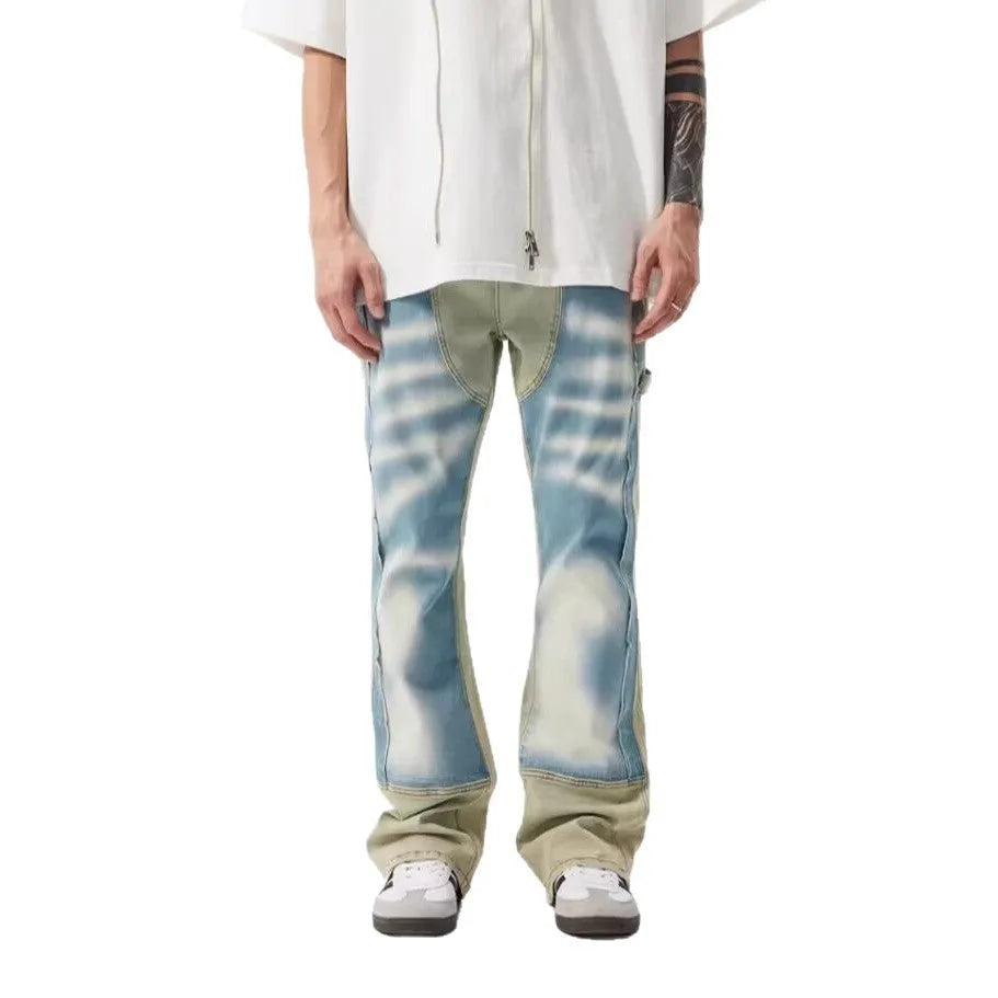 Yellow and blue retro patchwork distressed jeans with splash-ink design details on mid-waist denim trousers