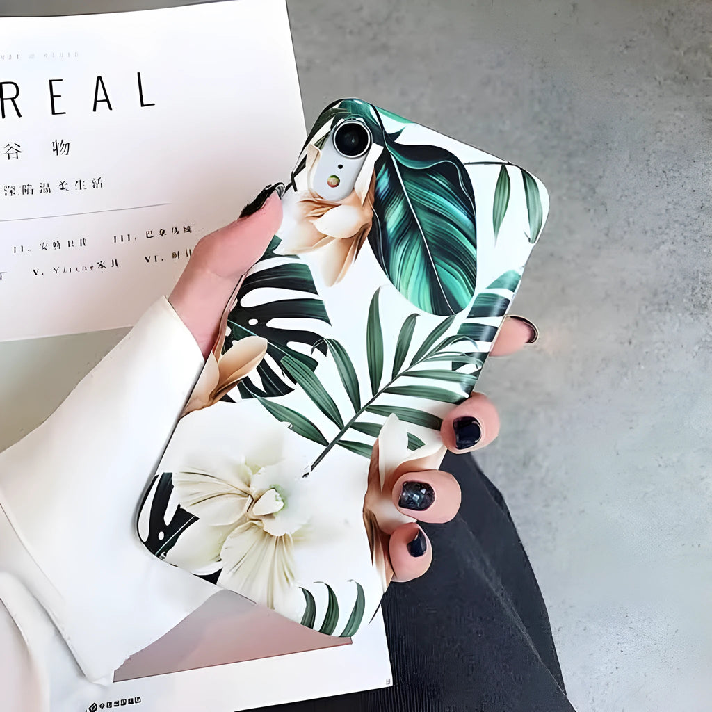 Soft TPU iPhone case with printed floral banana leaf design on the back.