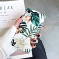 Soft TPU iPhone case with printed floral banana leaf design on the back.