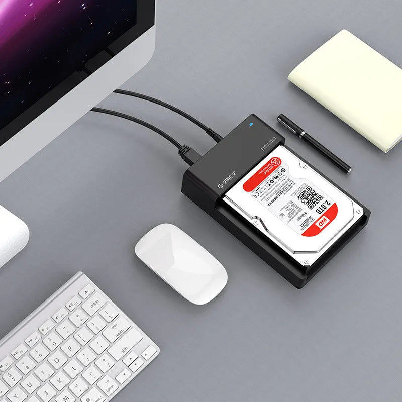 Black plastic external hard drive enclosure for 2.5 and 3.5 inch SATA drives with data cable