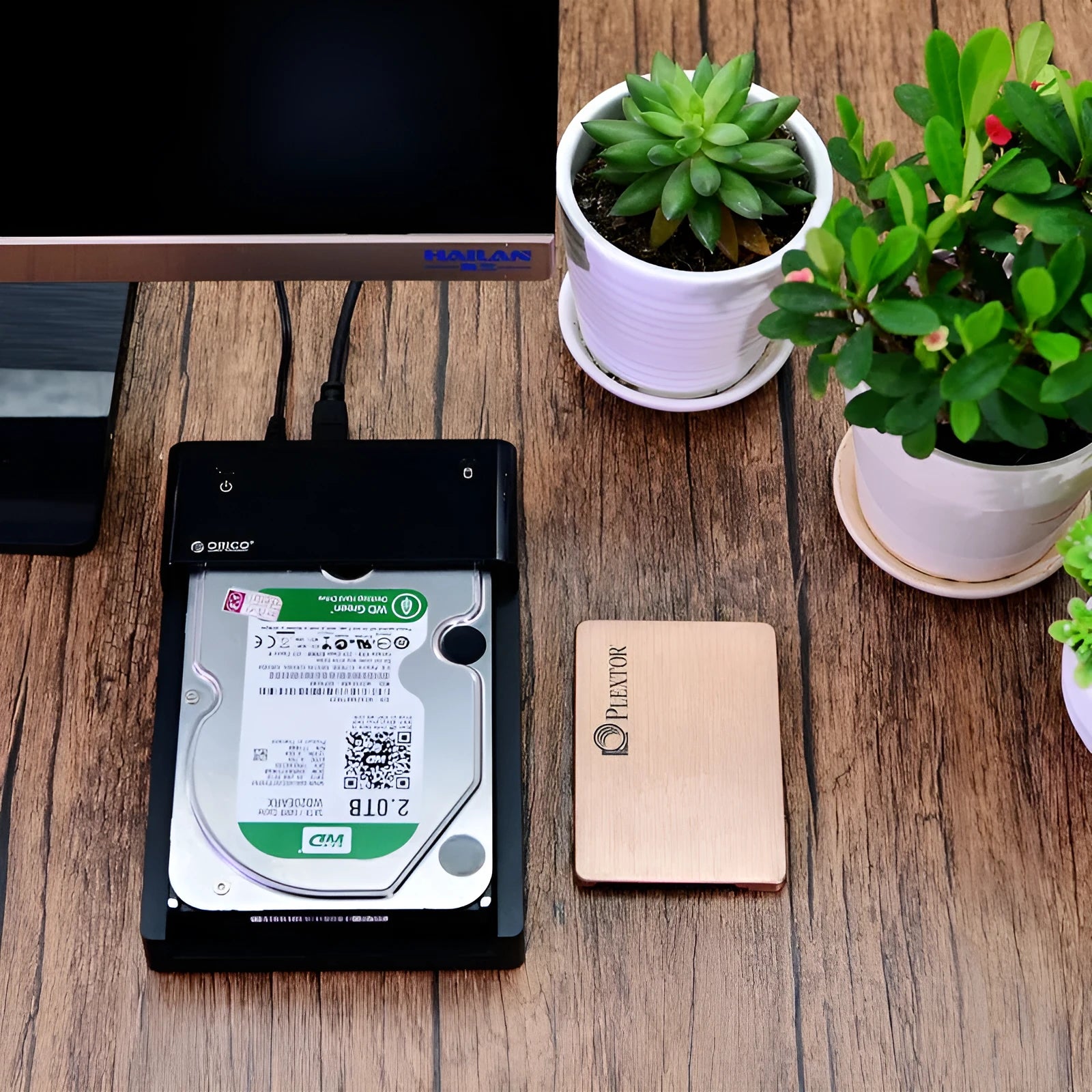 Black plastic external hard drive enclosure for 2.5 and 3.5 inch SATA drives with data cable