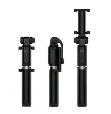 Aluminium Bluetooth selfie stick with tripod legs extended and wireless remote on a table