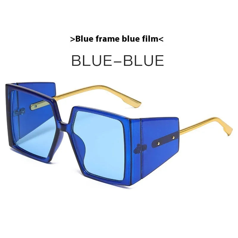 A pair of large square frame sunglasses on a white background, showing the oversized silhouette.