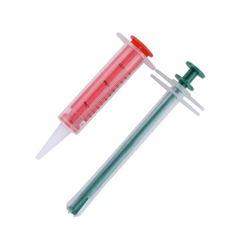 Two silica gel pet pill shooters for cats and dogs, showing soft tip and push rod.