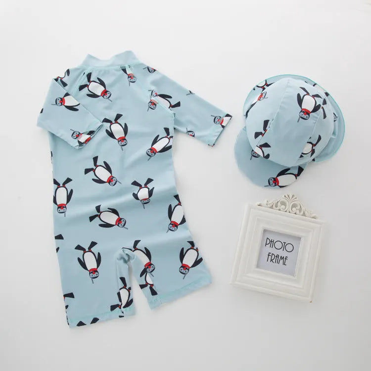 Boy's penguin print long sleeve swimsuit two-piece set with matching swimming cap