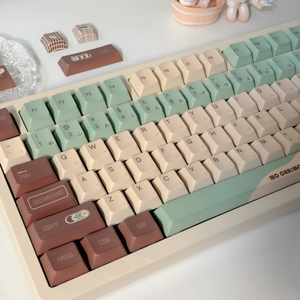 Matcha green mechanical keyboard keycap set with sublimation printing, shown with a key puller tool.