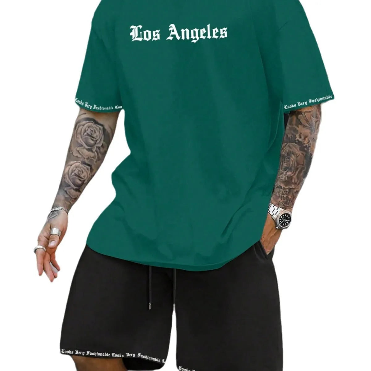 Men's grey sports short sleeve top and matching shorts set on hanger