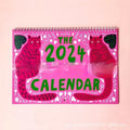 A3 Cat Calendar Wall Planner showing colourful monthly illustrations with hanging cord.