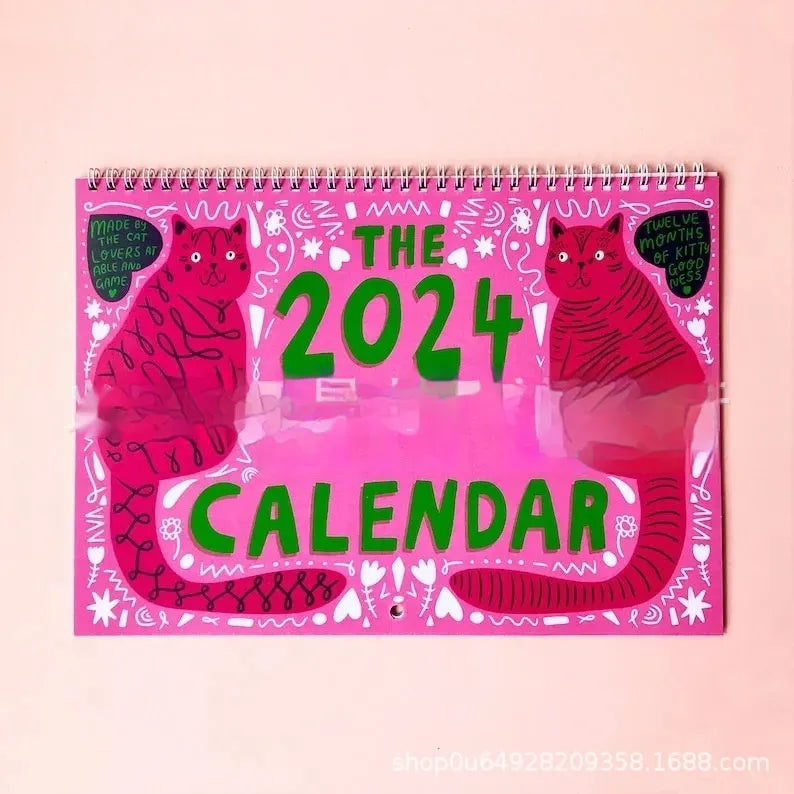 A3 Cat Calendar Wall Planner showing colourful monthly illustrations with hanging cord.