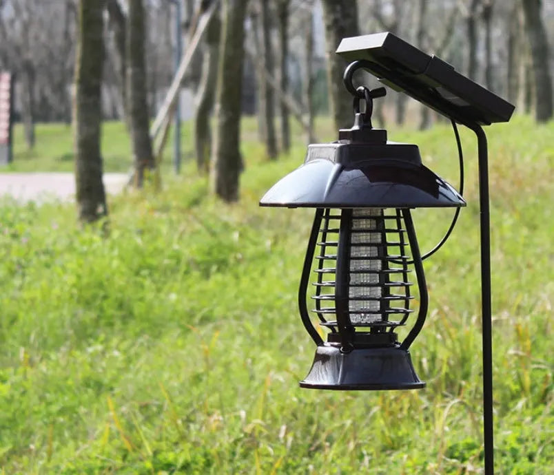 White and purple solar-powered mosquito lamp for outdoor garden use with solar panel and LED lights