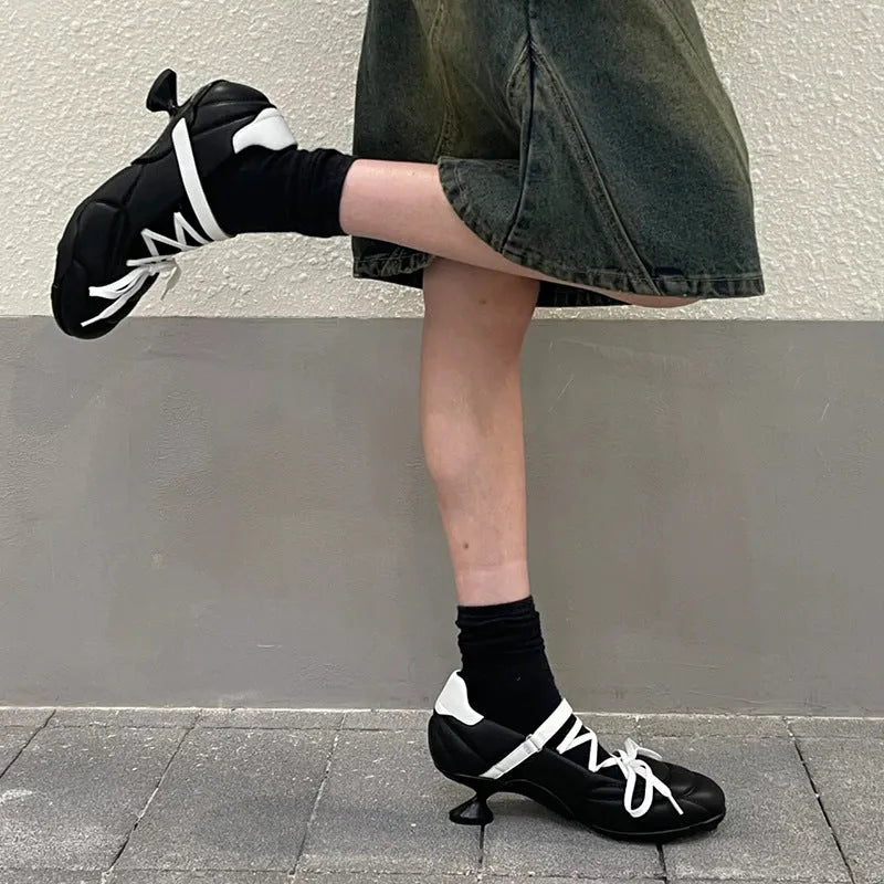 Women's silver lace-up bow sports shoes with mid heel and round toe on white background