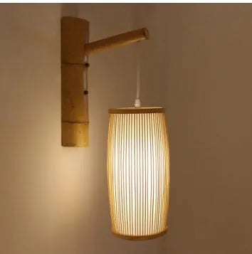 Bamboo wall light with woven plait design measuring 15cm diameter