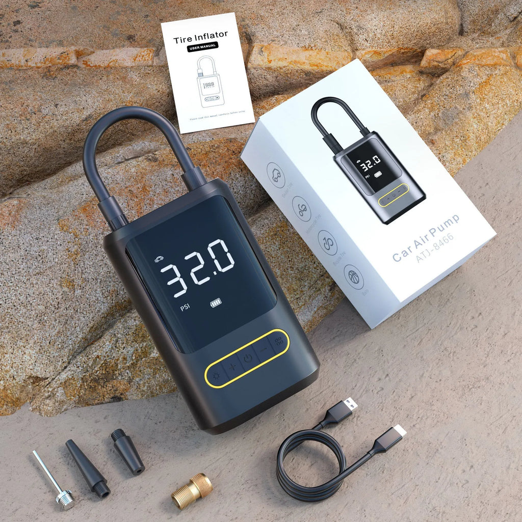 Handheld wireless digital display air pump with LED light shown inflating a car tyre