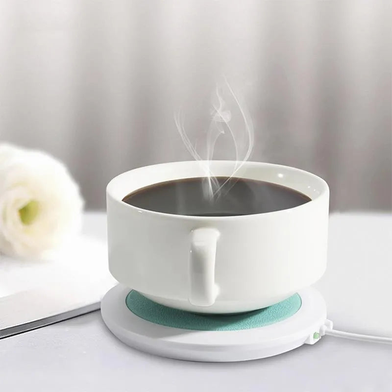 USB heating coaster in black, blue, and orange colours showing USB cable connection