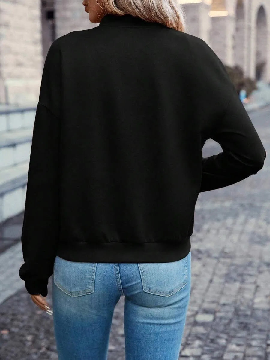 Women's black casual zip jacket with long sleeves and faux pockets