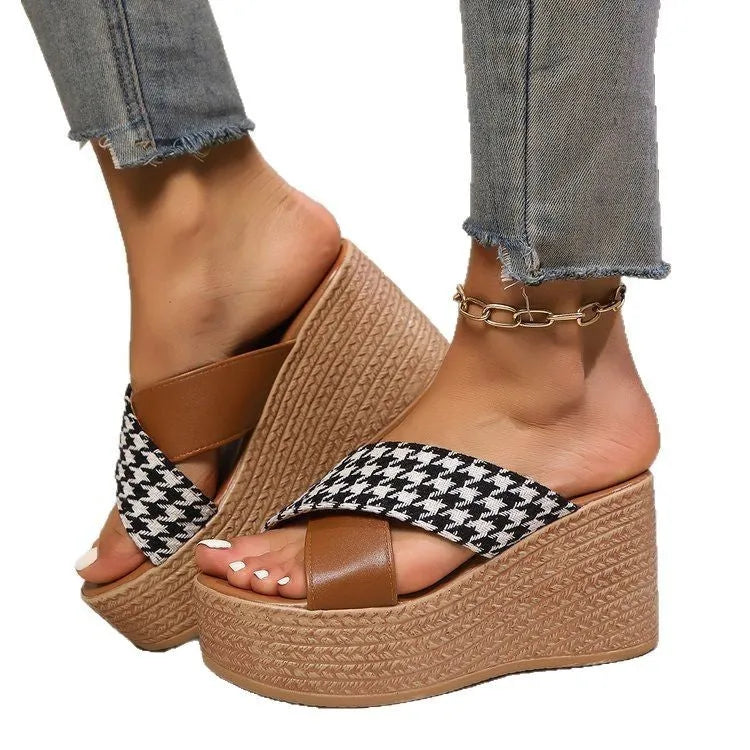 Brown and black cross leopard plaid pattern wedge sandals with a rubber sole.