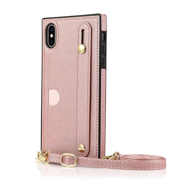 Black leather iPhone case with card holder slot and adjustable wristband holster attached.