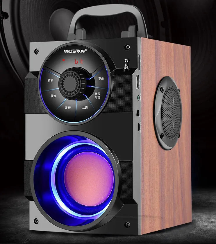 Black portable mini home audio system with subwoofer showing 3.5mm audio cable and USB power connection
